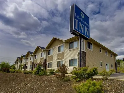 a building with a sign in front of it at Lake Country Inn in Winfield