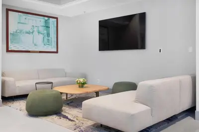 a living room with a couch and a table at Hotel Willo - previously known YWCA Hotel in Vancouver