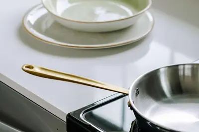 a frying pan and a bowl on a counter at Balcomo, a Ramada by Wyndham in Penticton