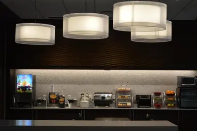 a kitchen with three lights and a counter at Wingate by Wyndham Kamloops in Kamloops