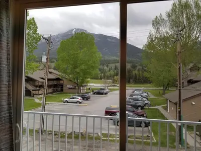 a view from a window of a parking lot at Lady MacDonald Country Inn in Canmore