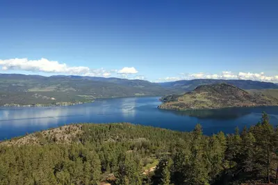 a view of a lake in the mountains at Sparkling Hill Resort and Spa - Adults-Only Resort in Vernon