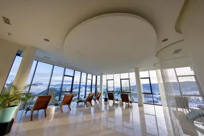 a row of chairs in a room with windows at Sparkling Hill Resort and Spa - Adults-Only Resort in Vernon