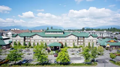 an aerial view of a hotel with a parking lot at Sandman Hotel Langley in Langley