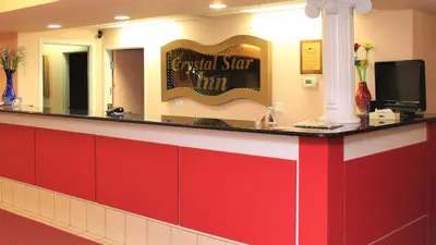 a red and white counter in a waiting room at Crystal Star Inn Edmonton Airport with free shuttle to and from Airport in Leduc