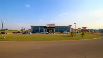 a gas station with cars parked in a parking lot at Crystal Star Inn Edmonton Airport with free shuttle to and from Airport in Leduc