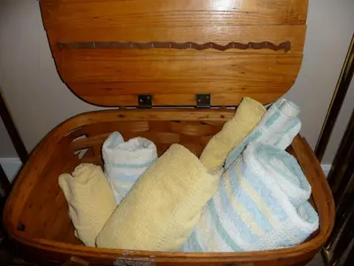 a basket filled with towels in a room at Cycle Inn Bed and Breakfast in Langford