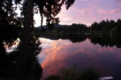 a view of a lake at sunset at Cycle Inn Bed and Breakfast in Langford