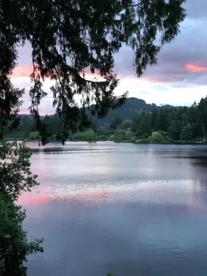 a view of a lake at sunset at Cycle Inn Bed and Breakfast in Langford