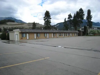 a building with a parking lot in front of it at Mary's Motel in Golden