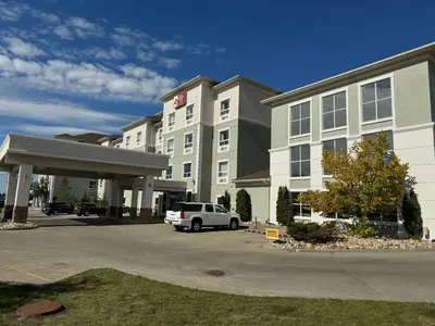 a hotel with a car parked in front of it at Best Western Plus South Edmonton Inn & Suites in Edmonton