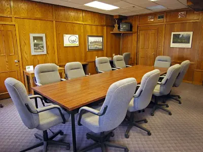 a conference room with a wooden table and chairs at Best Western Gold Rush Inn in Whitehorse