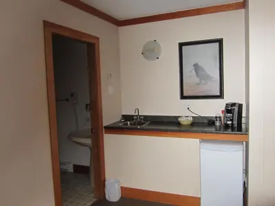 a bathroom with a sink and a toilet at The Lodge At Skeena Landing in Terrace