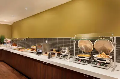 a buffet line with many food items on it at Hilton Vancouver Airport in Richmond