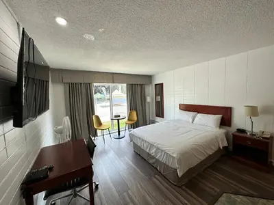 a hotel room with a bed and a desk and a desk at August Jack Inn in Squamish
