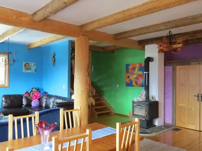 a living room with a table and a couch at Tschurtschenthaler Lodge in Golden