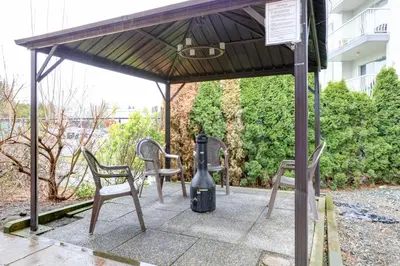 a pavilion with two chairs and a blender at Vedder River Inn in Chilliwack