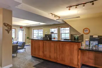 a bar in a waiting room with a counter at Vedder River Inn in Chilliwack