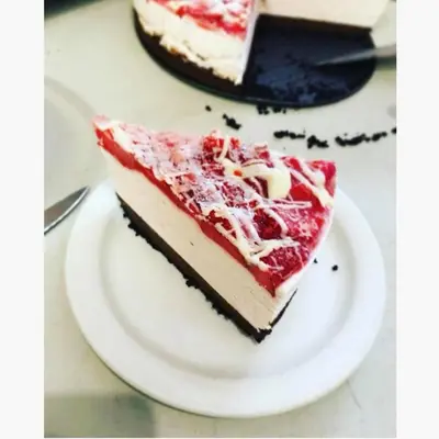 a slice of cake on a plate on a table at Barriere Motor Inn-BMI in Barrière