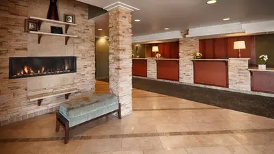 a lobby with a fireplace in a hotel room at Best Western PLUS Langley Inn in Langley