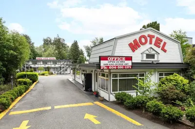 an empty parking lot in front of a motel at Linda Vista Motel in Surrey