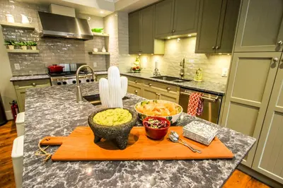 a kitchen counter with two bowls of food on a cutting board at CHATHAM HOUSE Kelowna Bed & Breakfast in Kelowna