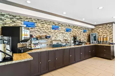 a coffee shop with a counter in a store at Best Western Maple Ridge in Maple Ridge District Municipality