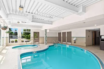 a pool in a hotel room with a large pool at Best Western Maple Ridge in Maple Ridge District Municipality