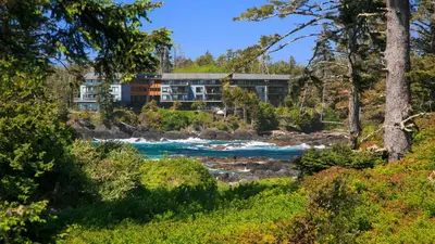 a view of a hotel from the river at Black Rock Beach House in Ucluelet