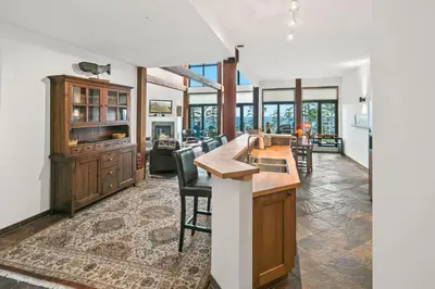 a kitchen with a wooden island in a room at Black Rock Ridge in Ucluelet