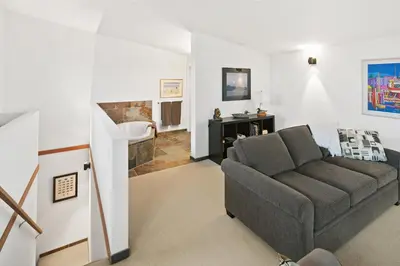 a living room with a couch and a fireplace at Black Rock Ridge in Ucluelet