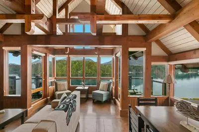 an open living room with a view of the water at Black Rock Landing in Ucluelet
