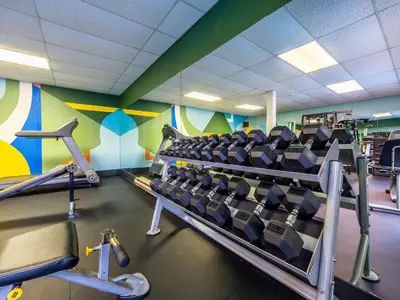 a gym with rows of chairs in a room at The Cedars Inn Hotel & Convention Centre in Gibsons