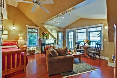 a living room with a couch and a table at Bonniebrook Lodge in Gibsons