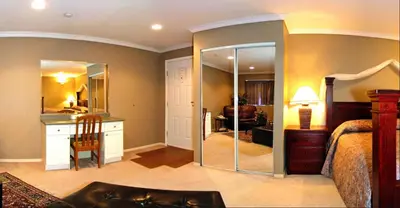 a bedroom with a bed and a mirror at Travelodge by Wyndham Merritt in Merritt