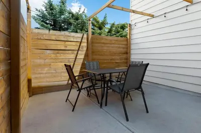 a table and chairs sitting on a patio at Travelodge by Wyndham Blairmore in Blairmore