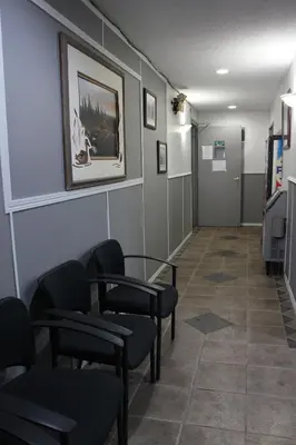 a waiting room with chairs and a table at Travelodge by Wyndham Blairmore in Blairmore