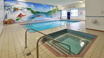 a large swimming pool with a painting on the wall at Prestige Lakeside Resort, WorldHotels Elite in Nelson