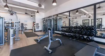 a gym with lots of treadmills and machines at Prestige Rocky Mountain Resort Cranbrook, WorldHotels Crafted in Cranbrook