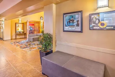 a waiting room with a bench in a lobby at Quality Inn & Suites in Rimbey