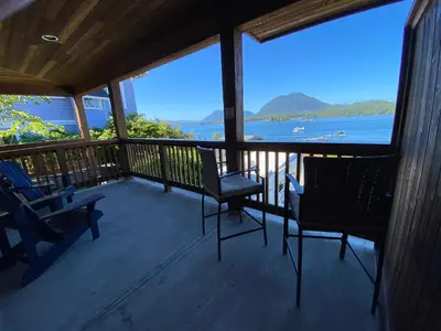 a porch with chairs and a view of the water at The Inn at Tough City in Tofino