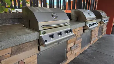 a row of stove tops on a brick wall at Sahara Courtyard Inn & Suites Osoyoos in Osoyoos