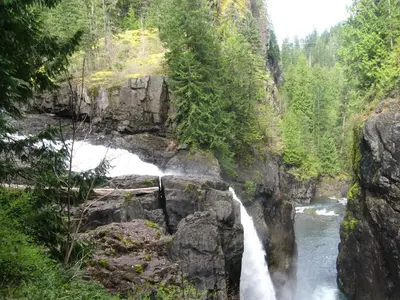 a waterfall in the middle of a river at Money Pennies Bed and Breakfast in Campbell River