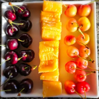 a tray of fruit and vegetables on a table at Villa Bellissimo FranTalia - Résidence & Galleriséum in Kelowna