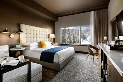 a hotel room with a bed and a window at The Josie Hotel, Autograph Collection in Rossland