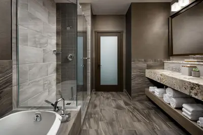 a bathroom with a tub and a shower and a sink at The Josie Hotel, Autograph Collection in Rossland