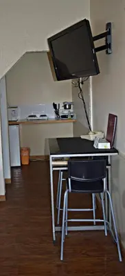 a desk with a computer monitor on top of it at Centre Suite Inns Motel in Bonnyville