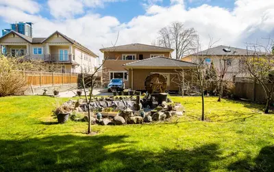 a house with a yard with a rock garden at An Yang House in Burnaby