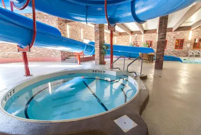 a large swimming pool with a water slide at BCMInns - Lloydminster in Lloydminster