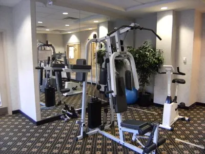 a gym with several tread machines in a room at Trickle Creek Lodge in Kimberley